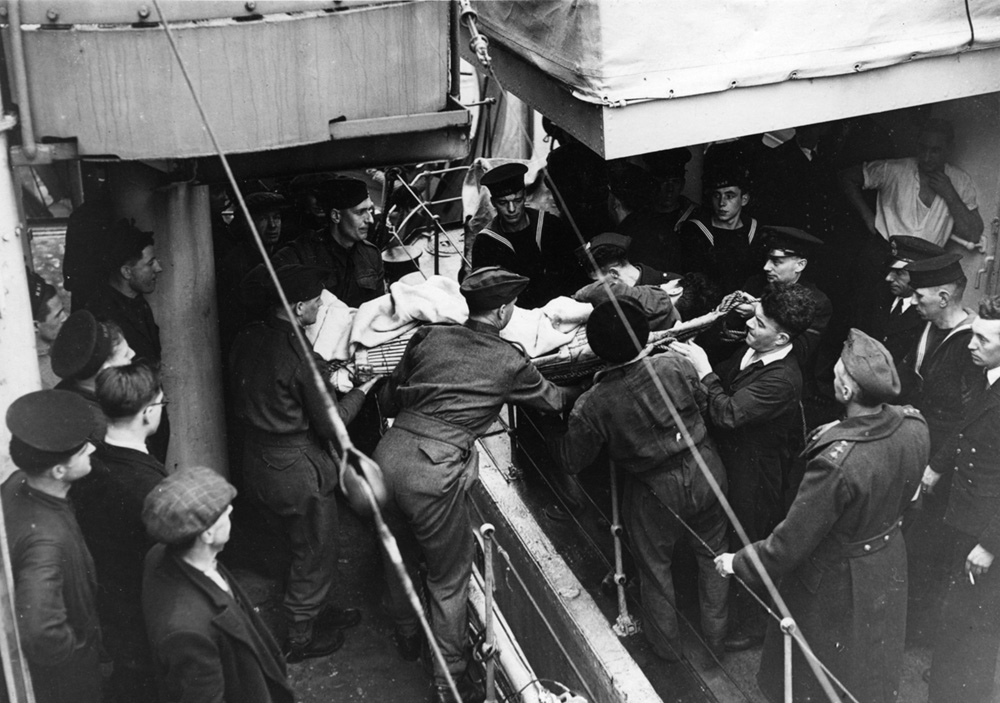 Taking wounded survivoes from the U-boat ashore