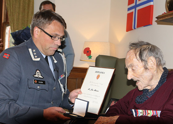 John Manners receiving the Medal of Honour