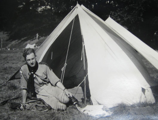 John Gibbons ooutside his tent at the Scouts Moot, Monzie Castle, in 1939