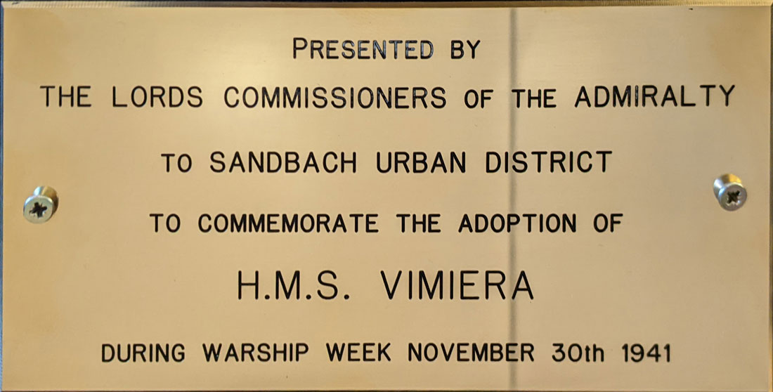 Inscribed plate mlounted beneath therestored crest of HMS Vimiera