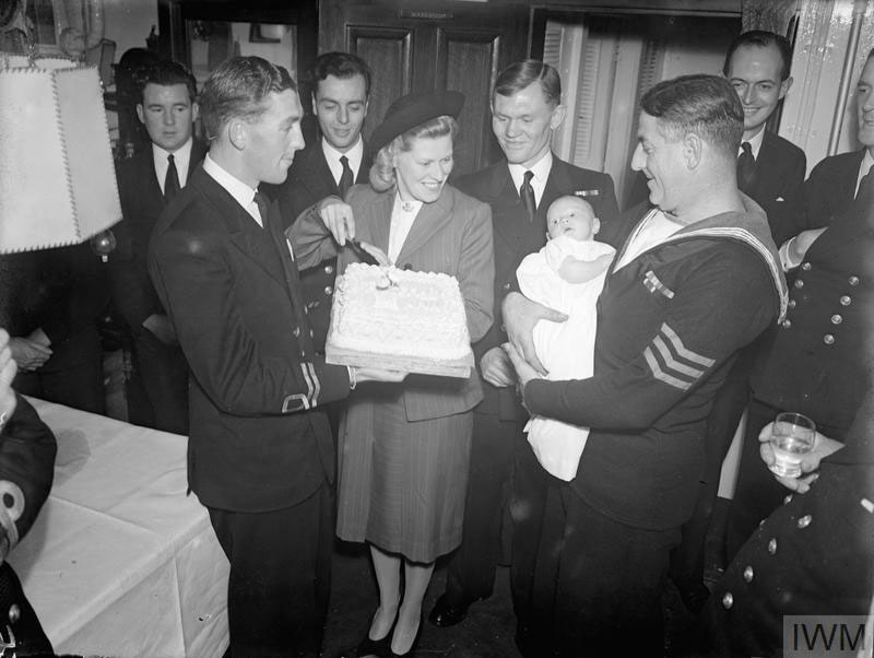 Christening of the daughter of Lt L.E. Blackmore RN aboard HMS Vivien