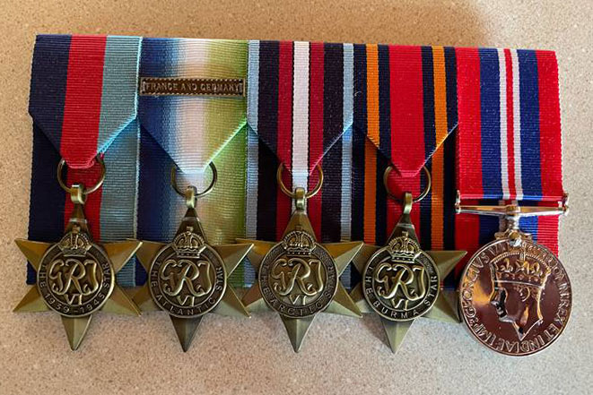 Replicas of thwe  medals awarded to Lt Cdr John James Glossop RN