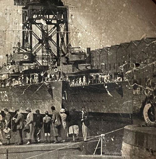 Photograph of HMS Warwick framed by Porthole