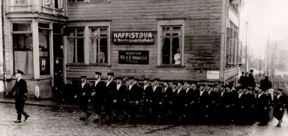 Ship's Company of HMS Wolsey marching through Stavanger on NOway's National Day