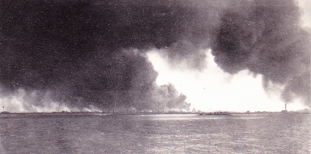 Dunkirk skyline with burning oil tanks