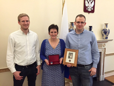 Barbara Walleer and her sons receive Thomas Murray's Ushakov Medal at the Russian Embassy