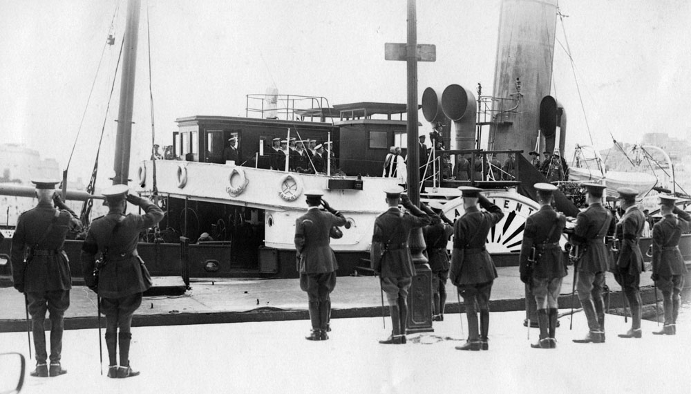 The paddle steamer tug is salutes as it leaves with the body of General Congreve