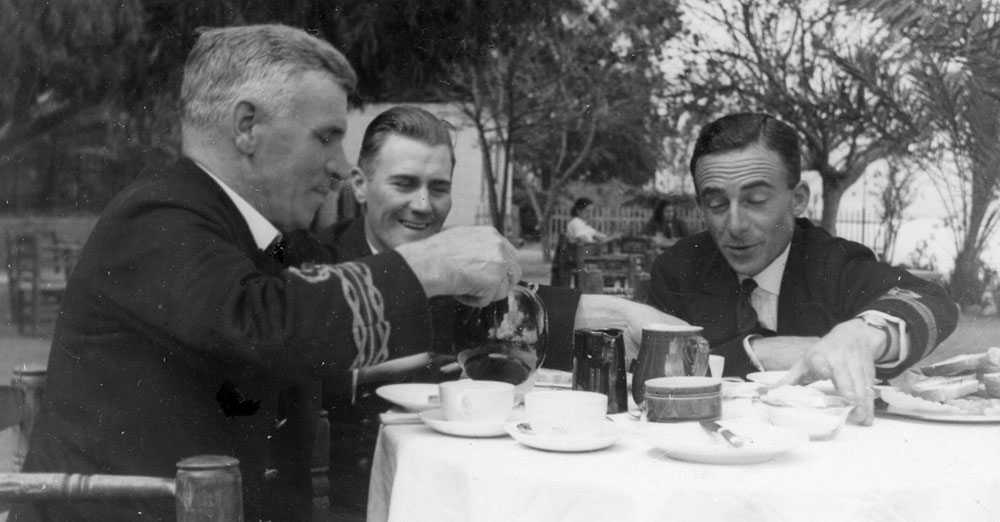 Three officers taking tea in a garden, nmes and date not known