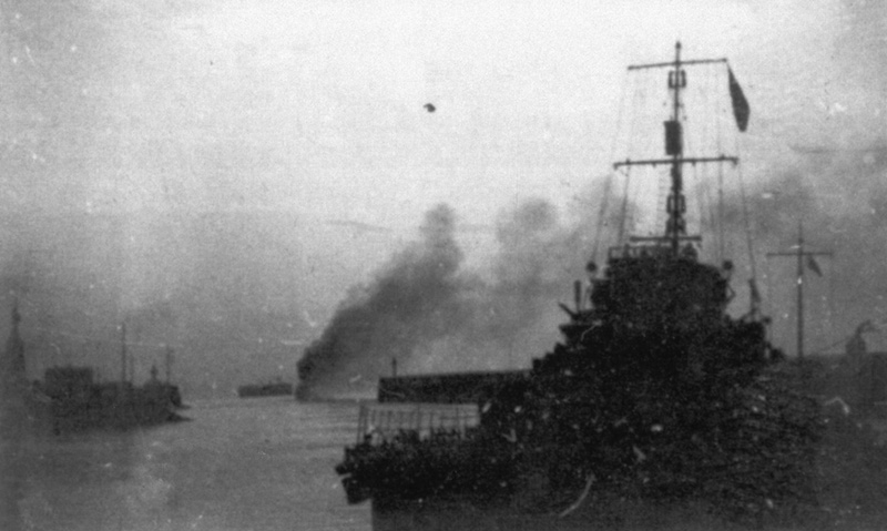 HMS Venewtia ablaze in Boulogne harbour entrance